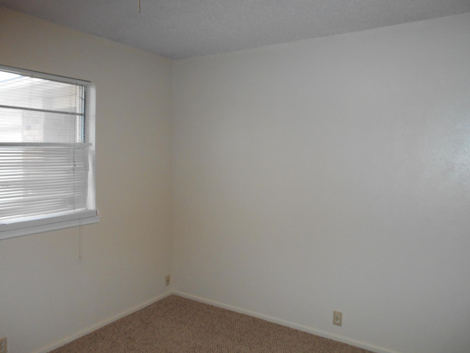 5401 14th Street Lubbock, TX 79416 - Photo 9 of 17 a room that has a window in it