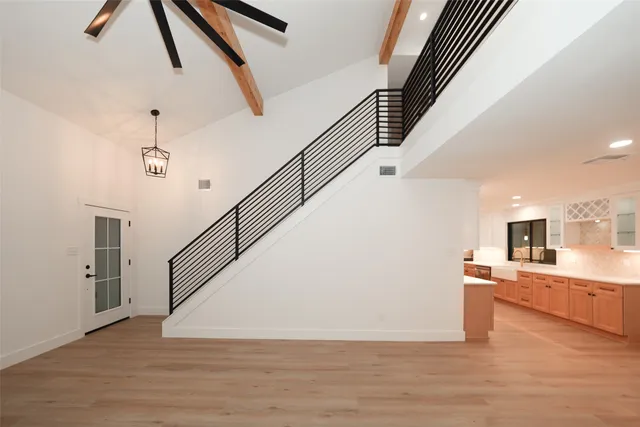 a view of a kitchen cabinets and wooden floor