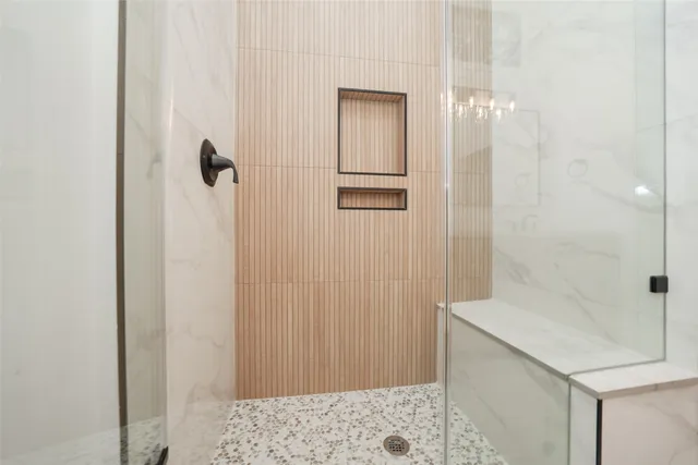 a bathroom with a shower and a sink