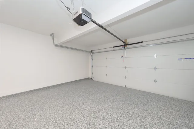 a view of cabinets and utility room with wooden floor