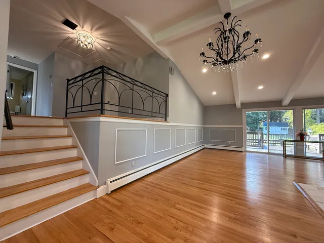 a view of an entryway with wooden floor