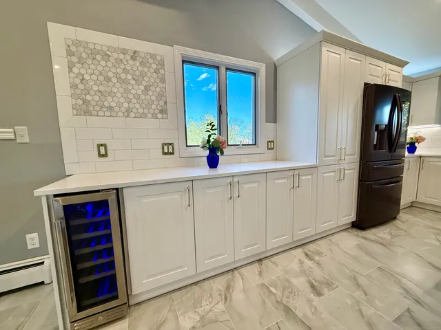 a kitchen with a sink and cabinets