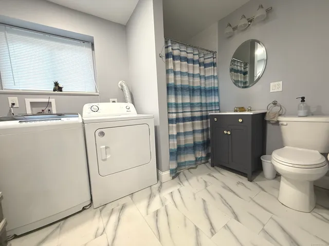 a view of a livingroom with wooden floor