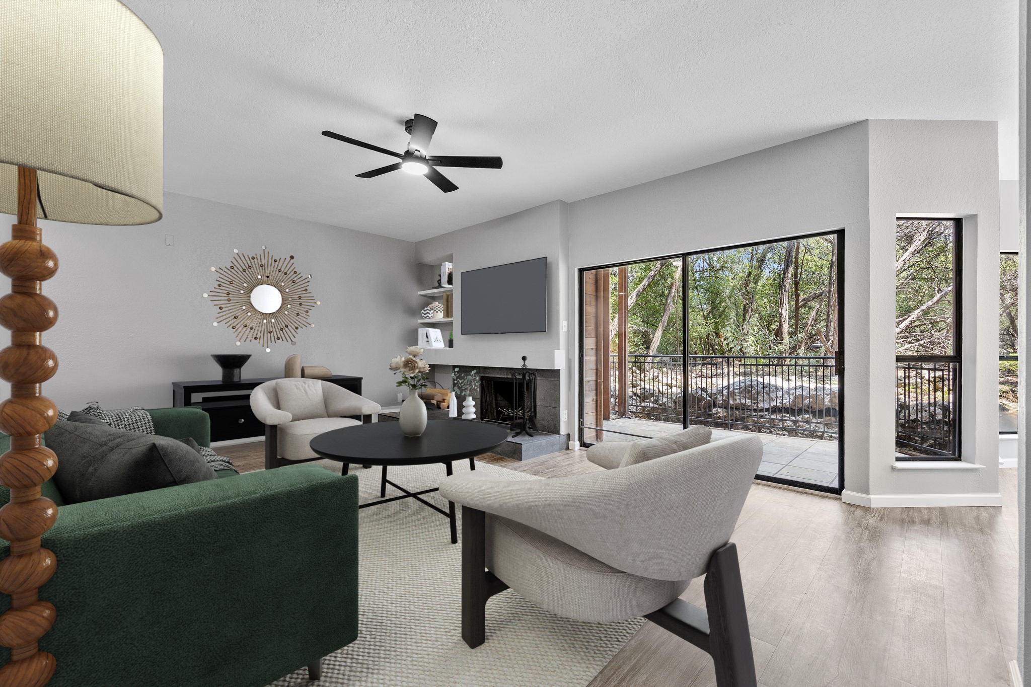4711 Spicewood Springs Road, Unit 1106 Austin, TX 78759 - Photo 2 of 19 Living area featuring large format sliding glass doors, a built-in fireplace with a dark stone surround, a ceiling fan with integrated lighting, and wood-finish flooring