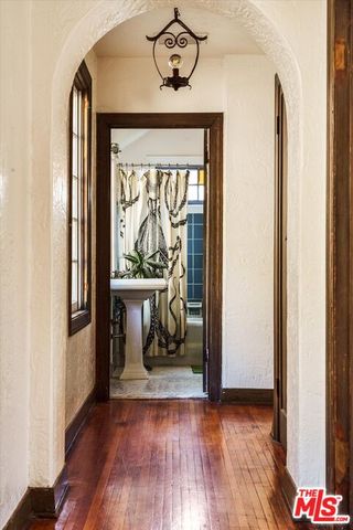 a wooden bench sitting in front of a house