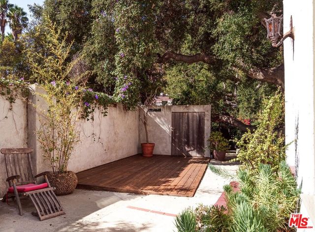 a bedroom with a bed and a table