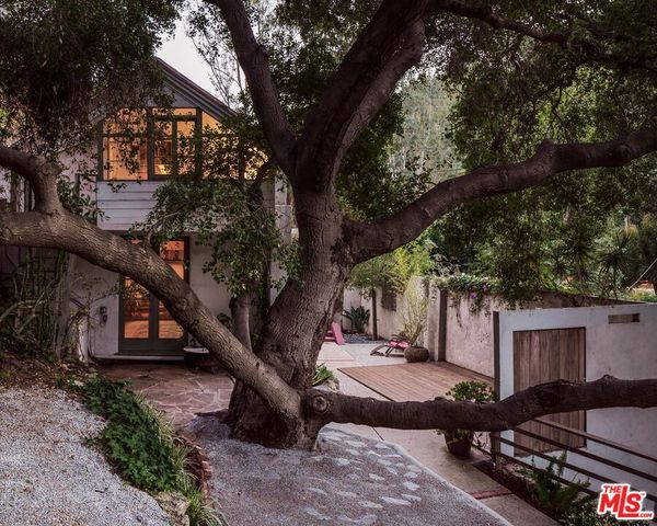 a view of sitting area in the backyard of house
