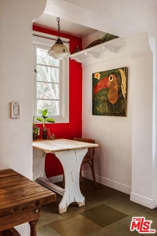 a kitchen with a sink cabinets and window