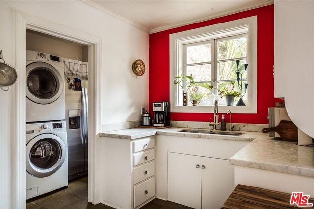 a kitchen with a stove and a window