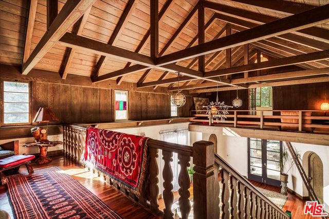 a backyard of a house with barbeque oven table and chairs