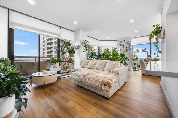 a living room with furniture and a large window