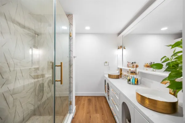 a bathroom with a potted plant and a sink