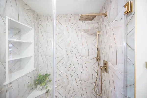 a view of walk in closet with clothes