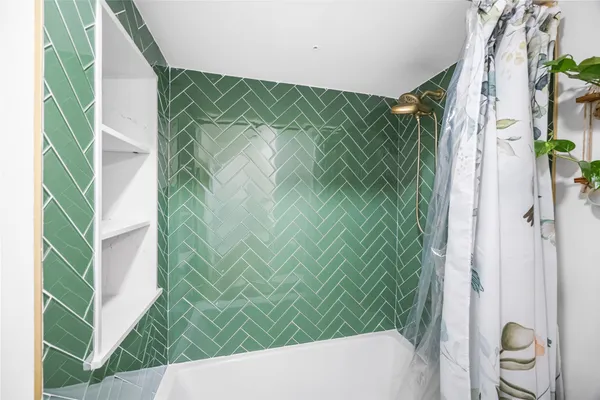 a bedroom with a bed table and window