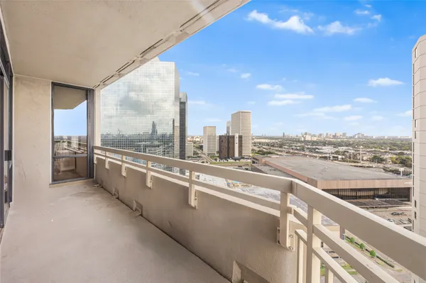 a dining room with furniture a chandelier and wooden floor