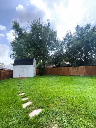 a backyard of a house with lots of green space