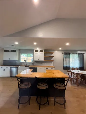 a room with furniture and pool table