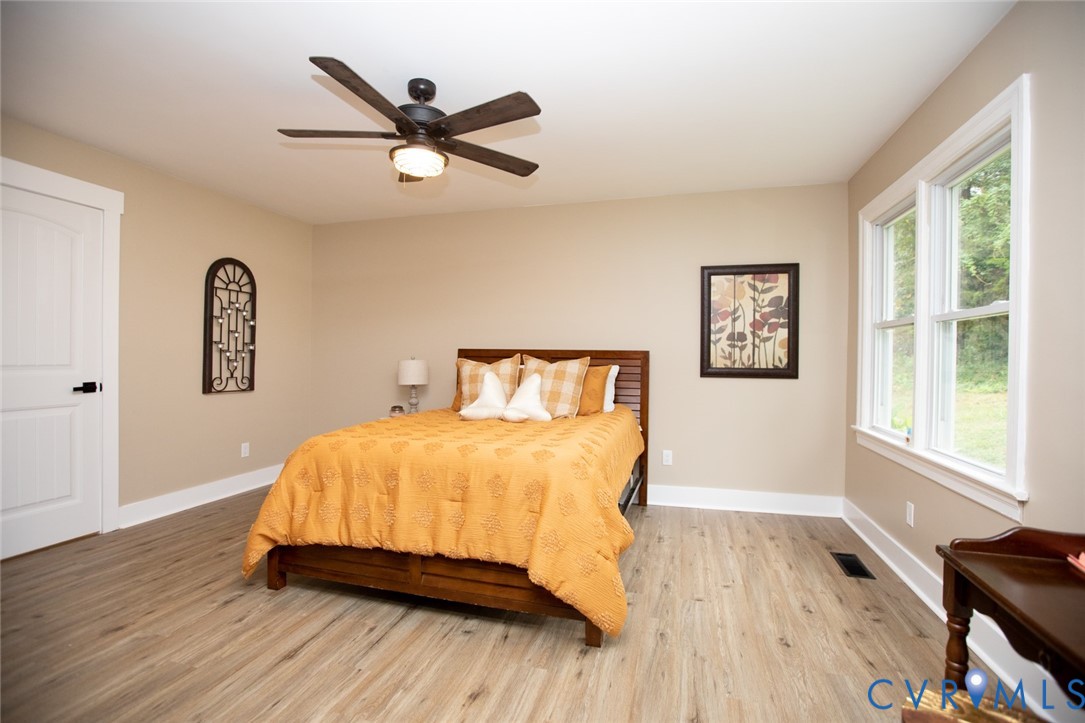 3153 West 3rd Street Farmville, VA 23901 - Photo 29 of 63 a bedroom with a bed and wooden floor