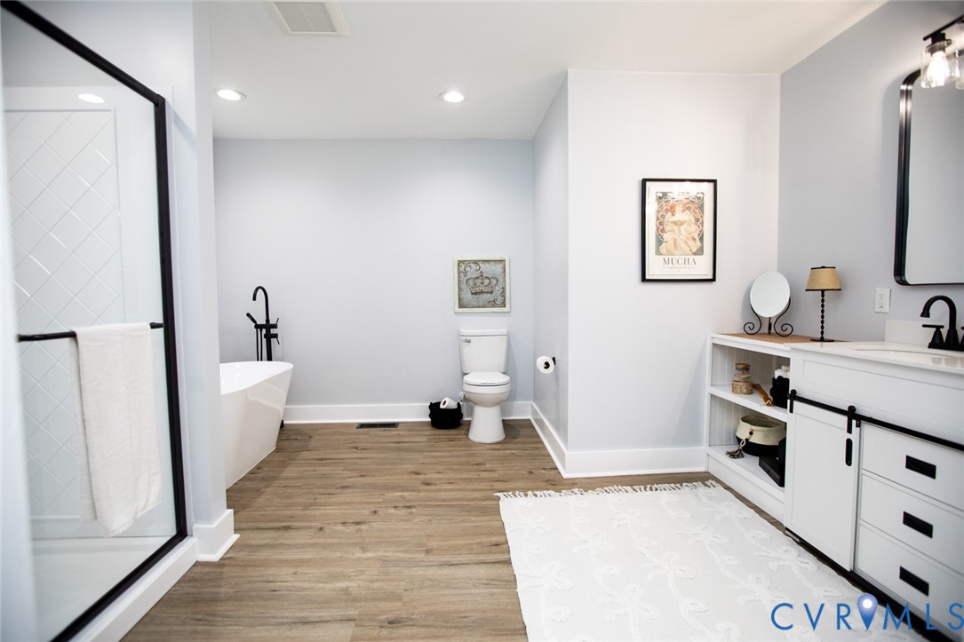 3153 West 3rd Street Farmville, VA 23901 - Photo 37 of 63 a bathroom with a sink a toilet a tub and shower