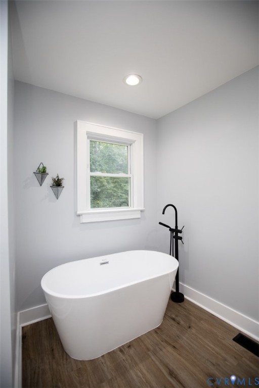 3153 West 3rd Street Farmville, VA 23901 - Photo 42 of 63 a white bath tub sitting in a bathroom