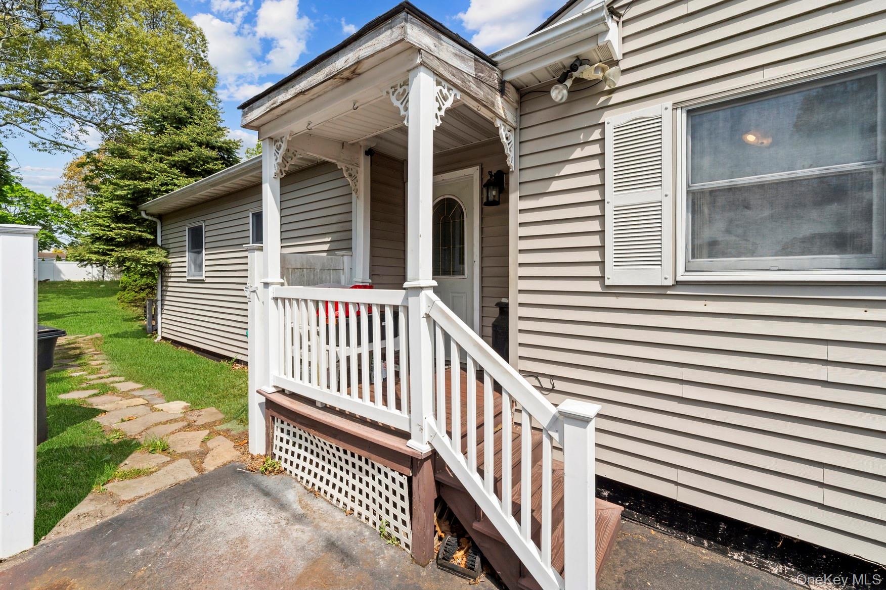 164 Dare Road Selden, NY 11784 - Photo 6 of 20 a view of a house with a yard and deck
