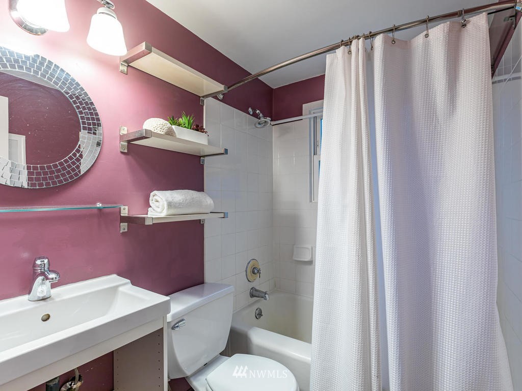 9222 12th Avenue Southwest Seattle, WA 98106 - Photo 13 of 30 a bathroom with a sink toilet and shower