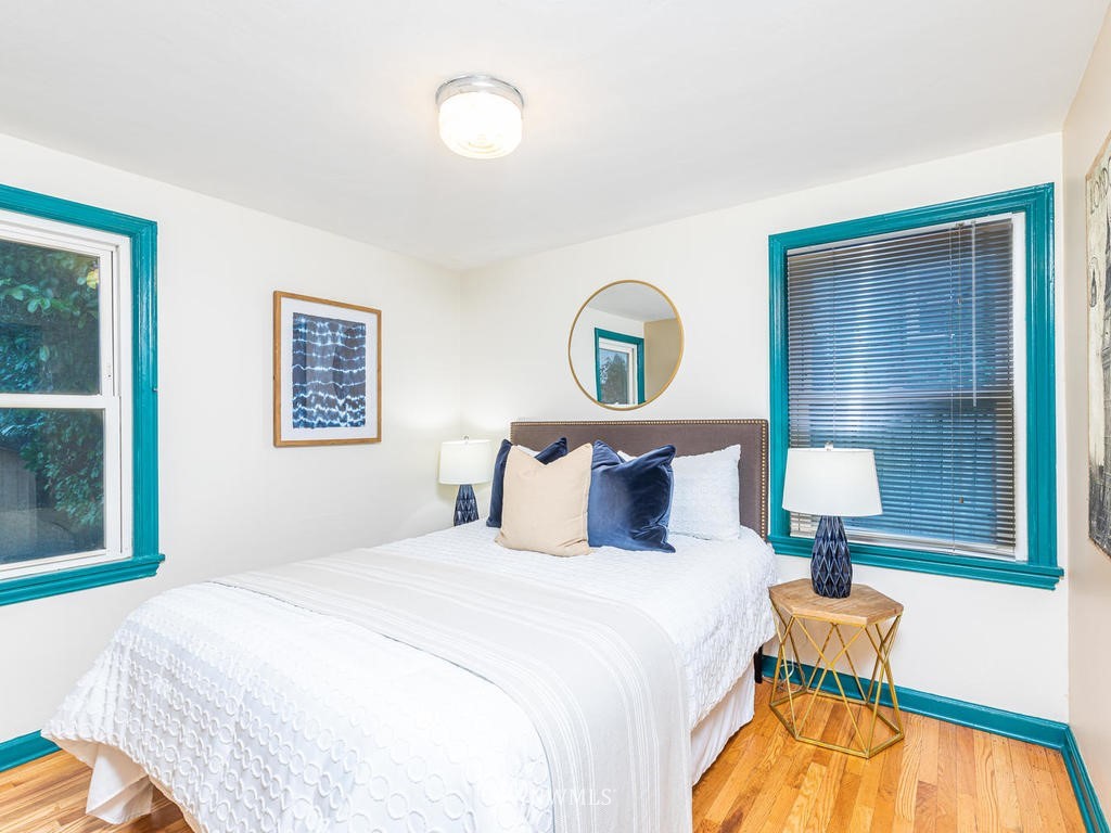 9222 12th Avenue Southwest Seattle, WA 98106 - Photo 14 of 30 a bedroom with a bed and a painting on the wall