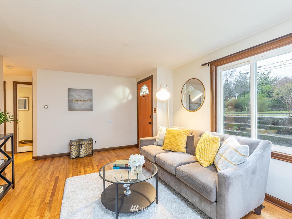 9222 12th Avenue Southwest Seattle, WA 98106 - Photo 4 of 30 a living room with furniture and a large window