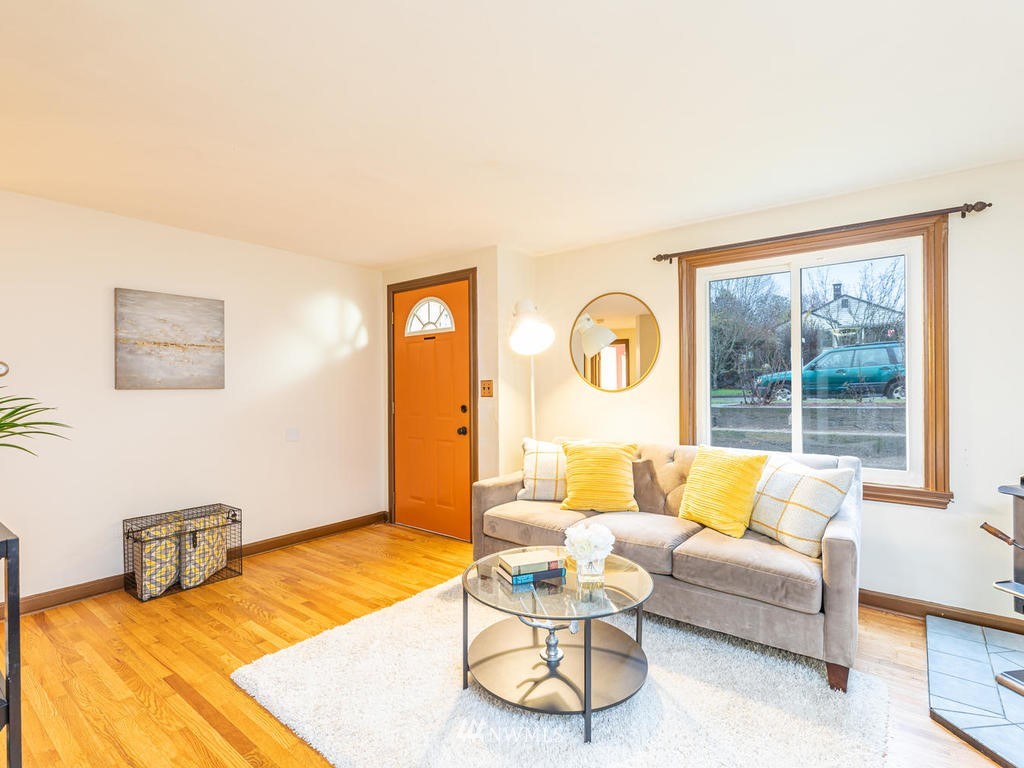 9222 12th Avenue Southwest Seattle, WA 98106 - Photo 6 of 30 a living room with furniture and a large window
