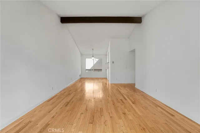 a view of a kitchen with wooden floor and a sink