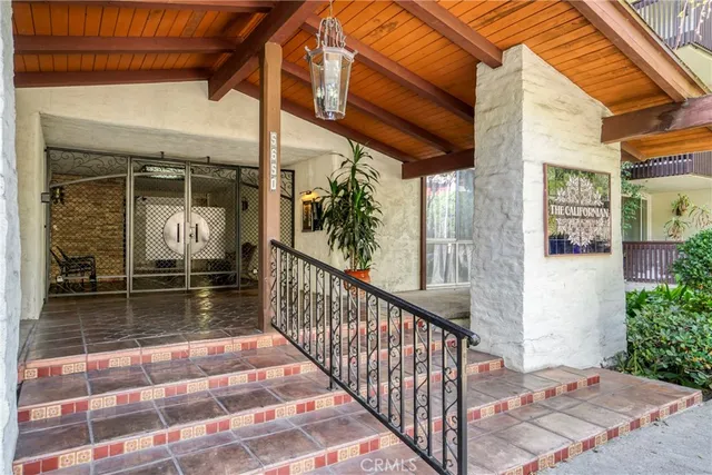 a view of a livingroom with furniture and front door