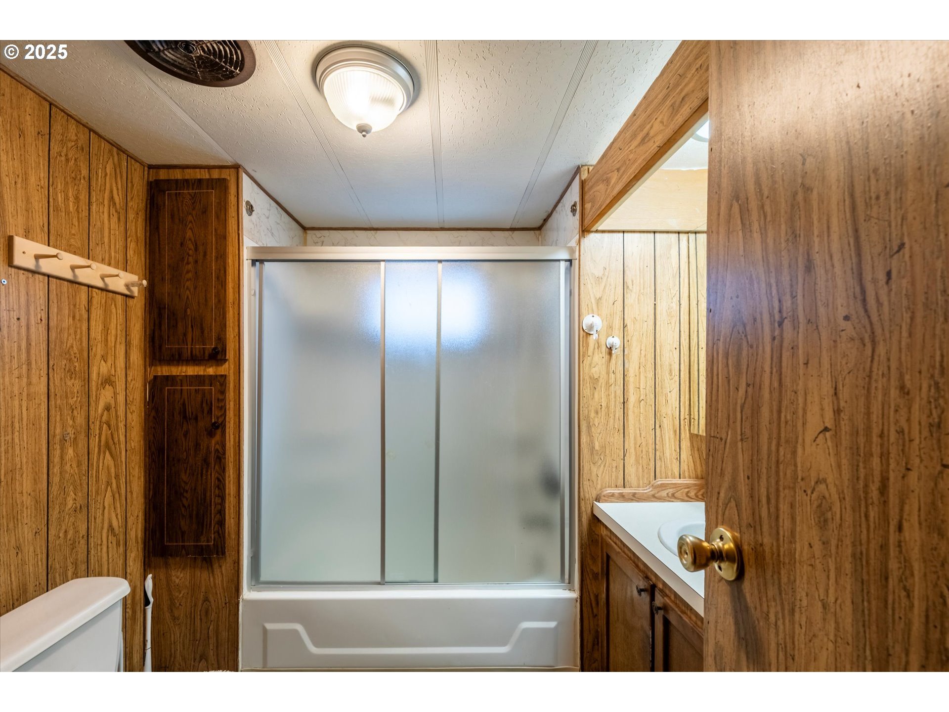 125 North 4th Street Lakeside, OR 97449 - Photo 21 of 38 a view of a hallway with wooden floor