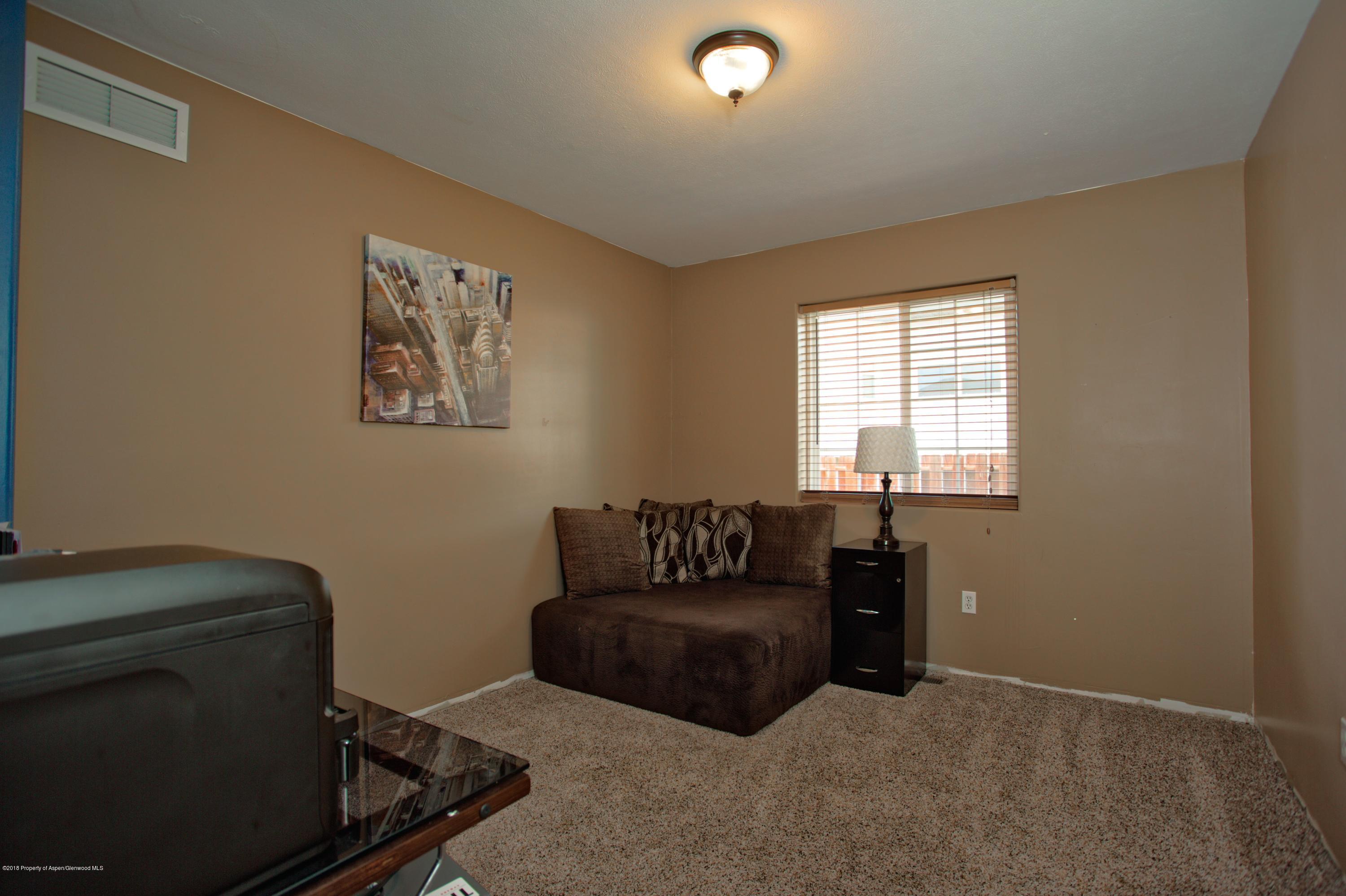 841 Hickory Drive Rifle, CO 81650 - Photo 12 of 20 a living room with furniture and a window