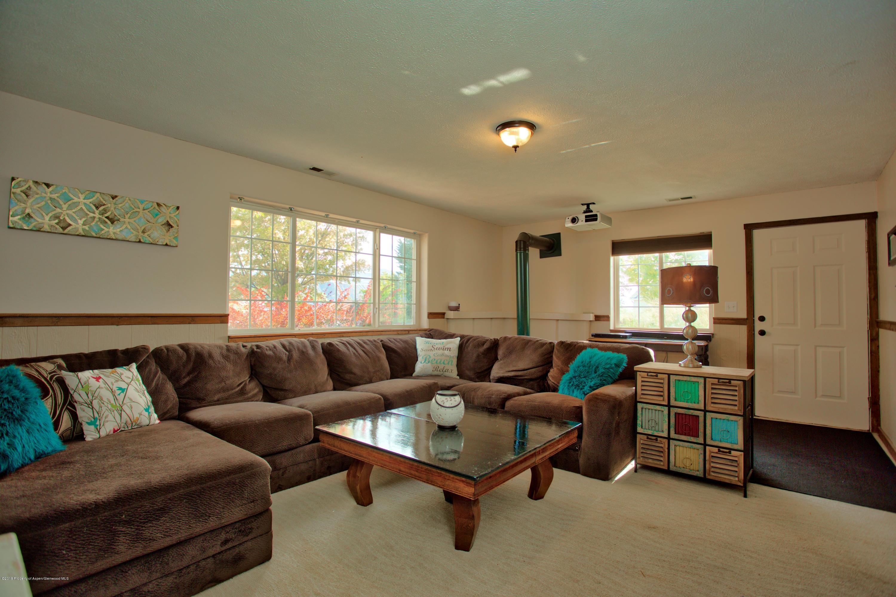 841 Hickory Drive Rifle, CO 81650 - Photo 15 of 20 a living room with furniture and a large window
