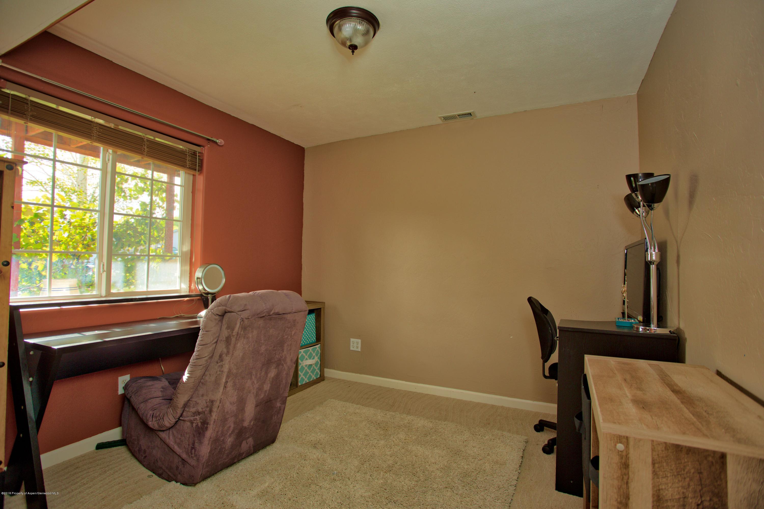 841 Hickory Drive Rifle, CO 81650 - Photo 18 of 20 a living room with furniture and a window