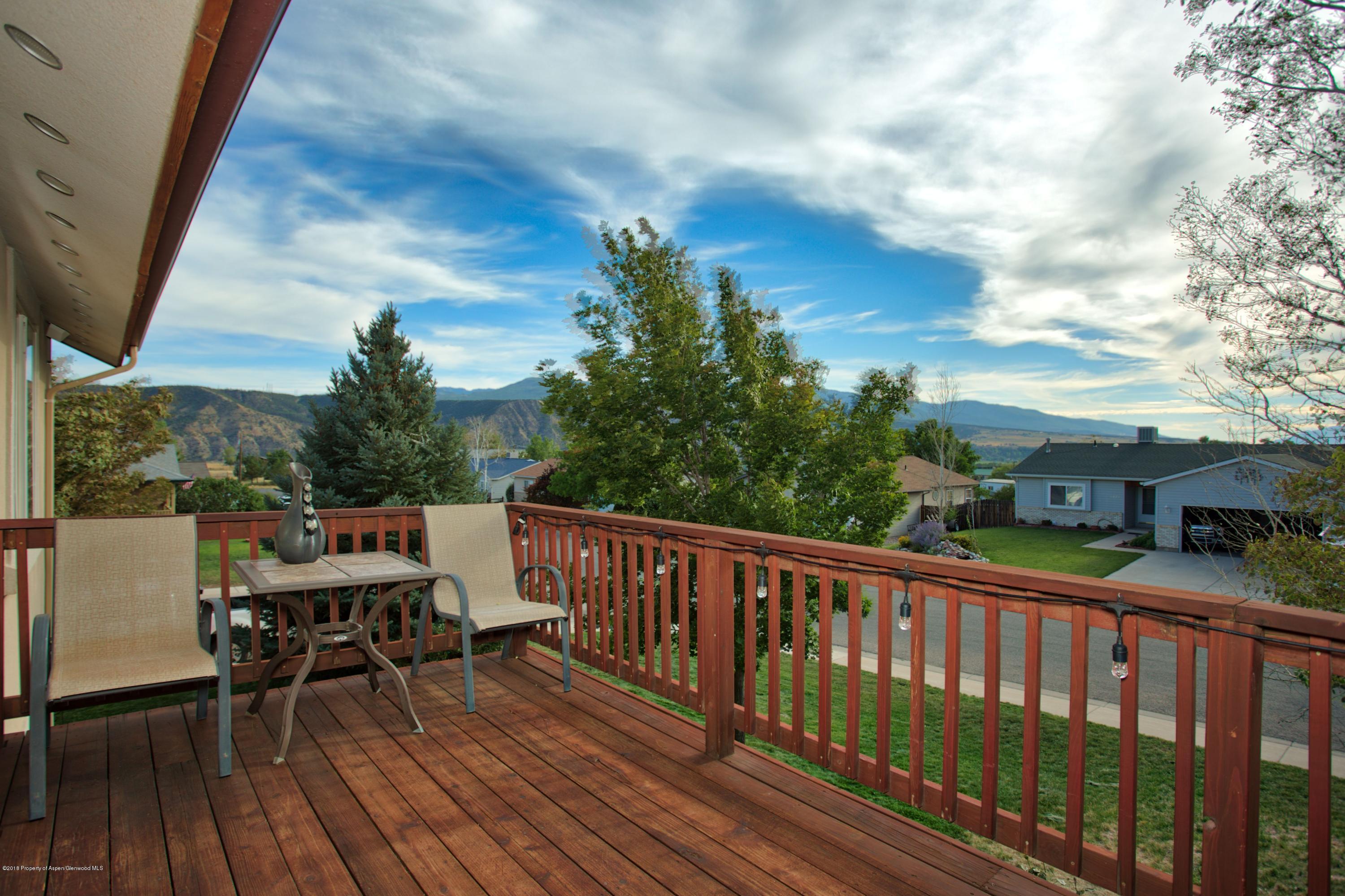 841 Hickory Drive Rifle, CO 81650 - Photo 20 of 20 a view of a balcony with furniture and wooden floor