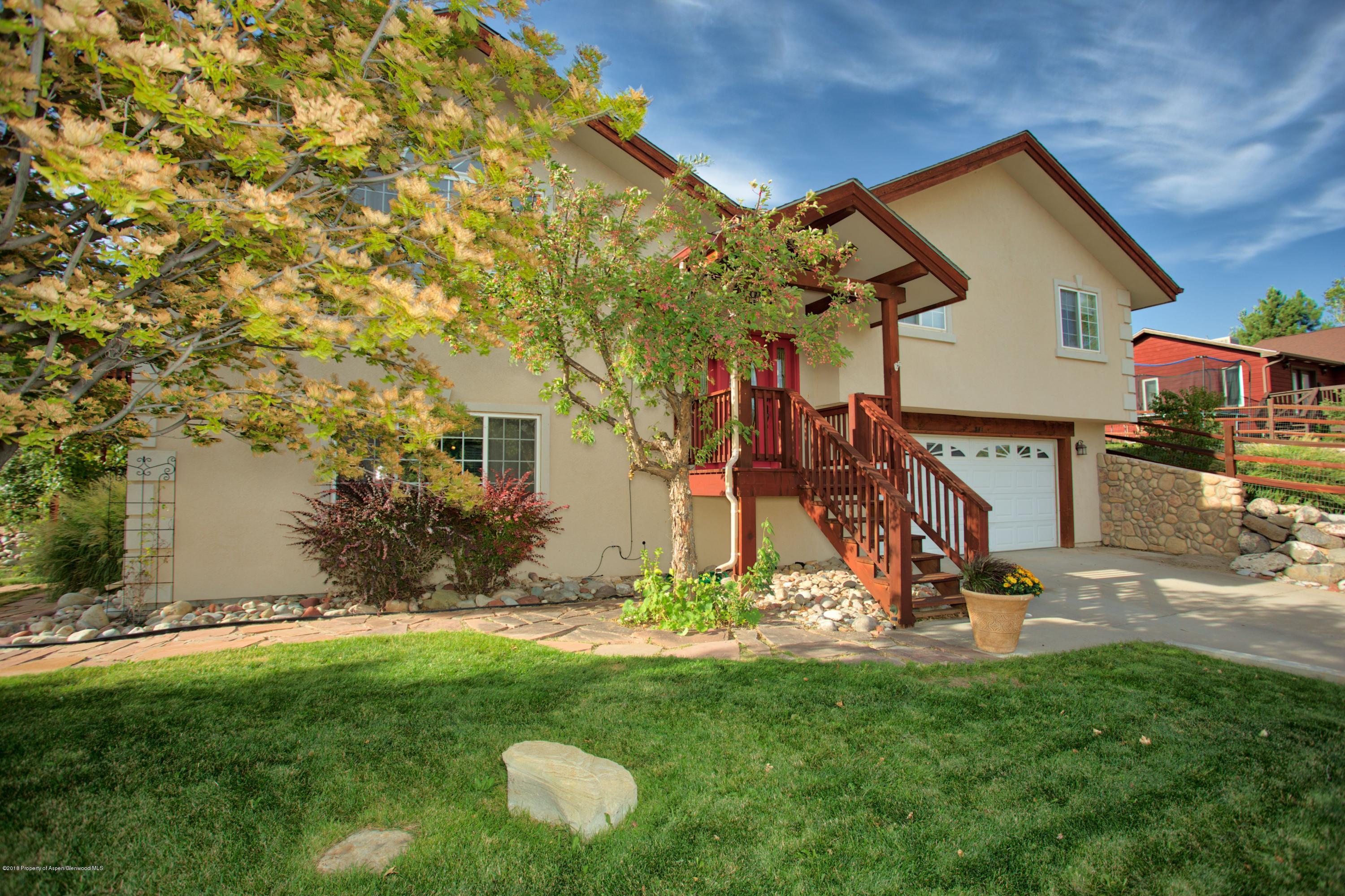 841 Hickory Drive Rifle, CO 81650 - Photo 2 of 20 a view of a house with a backyard