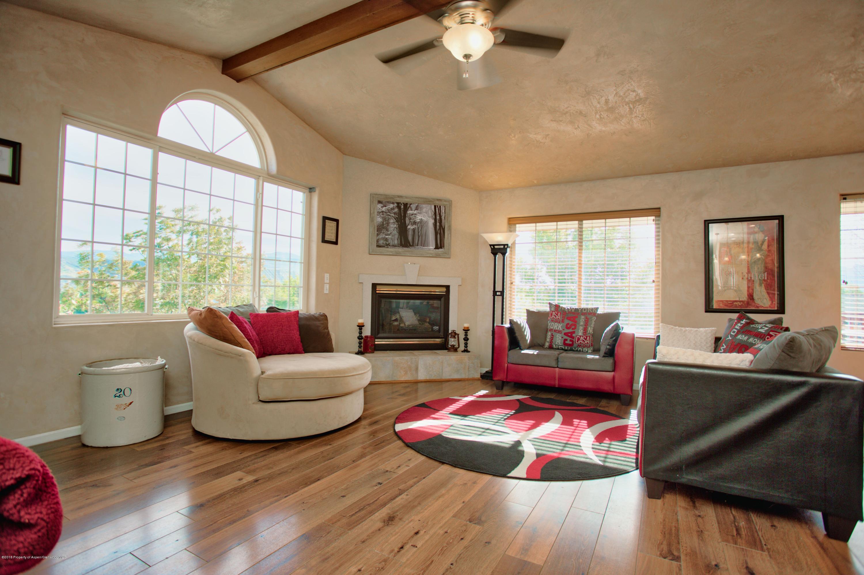 841 Hickory Drive Rifle, CO 81650 - Photo 4 of 20 a living room with furniture and a fireplace