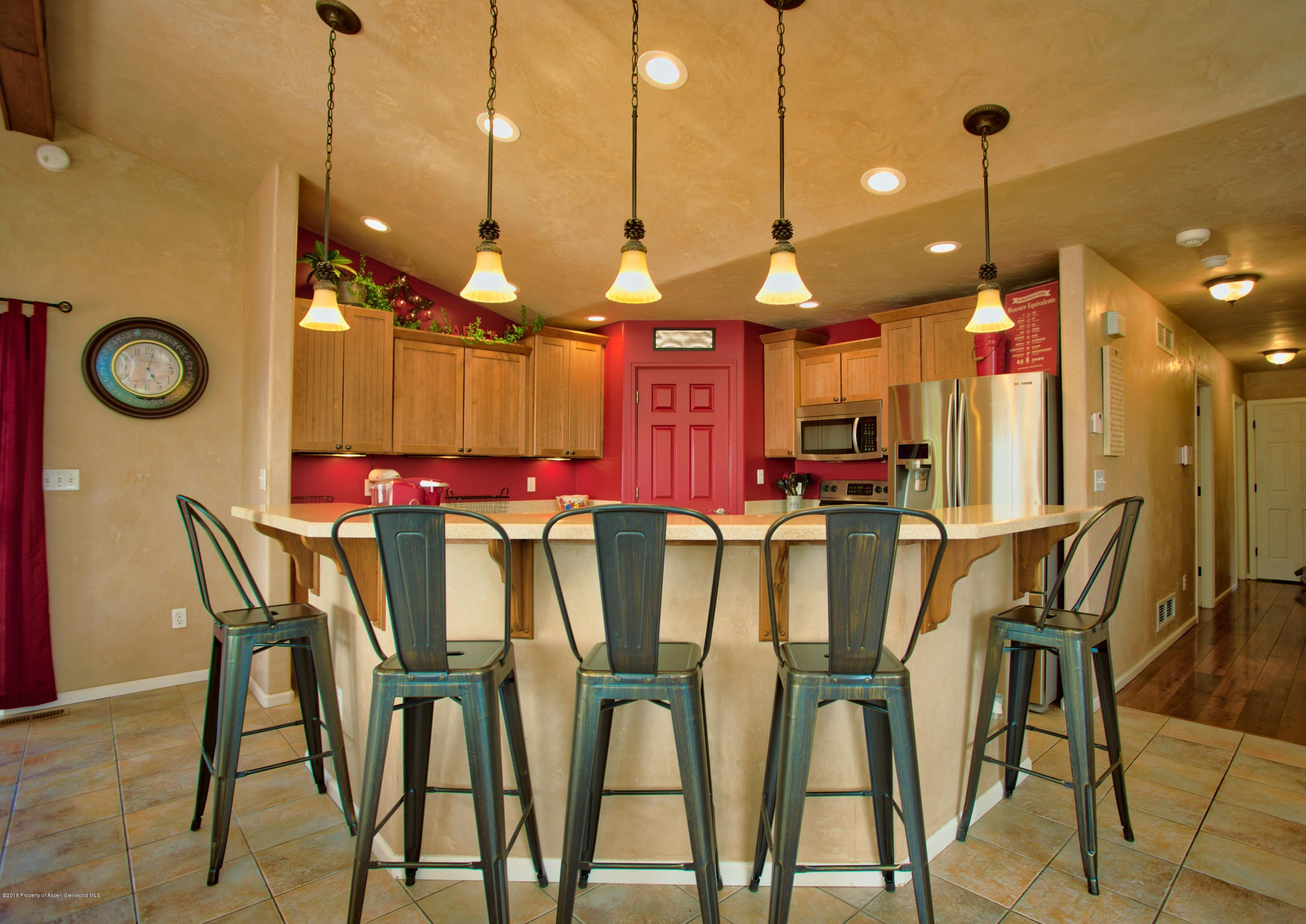 841 Hickory Drive Rifle, CO 81650 - Photo 7 of 20 a dinning area with furniture and kitchen view
