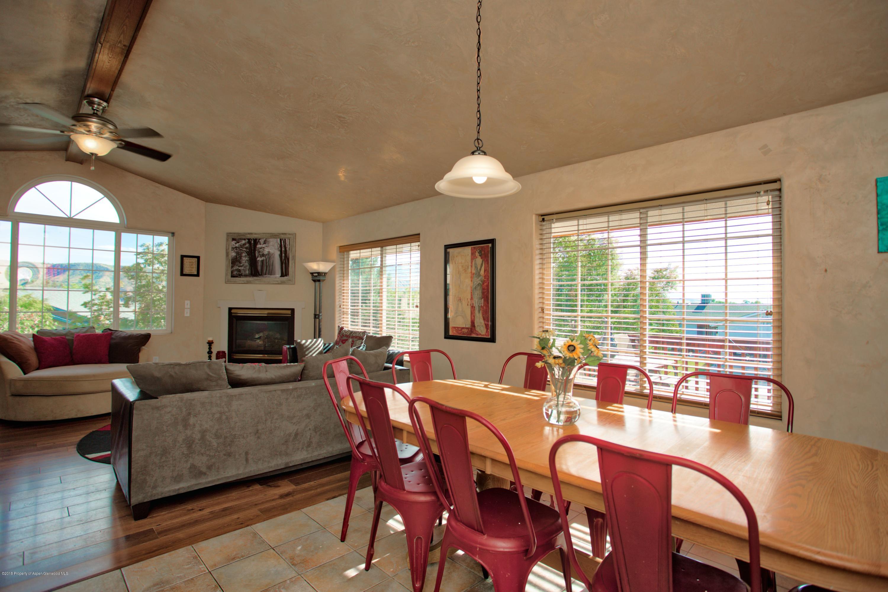 841 Hickory Drive Rifle, CO 81650 - Photo 9 of 20 a view of a dining room with furniture window and outside view