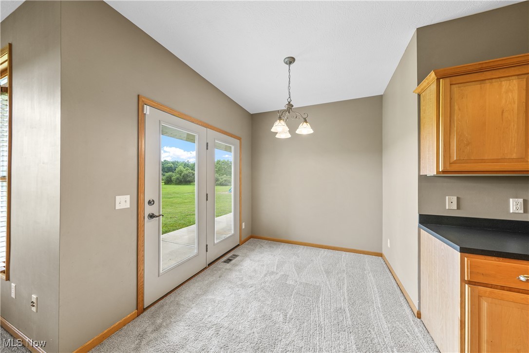 4840 Wayne Road Mantua, OH 44255 - Photo 10 of 42 Breakfast Room with beautiful view and direct access to covered back porch
