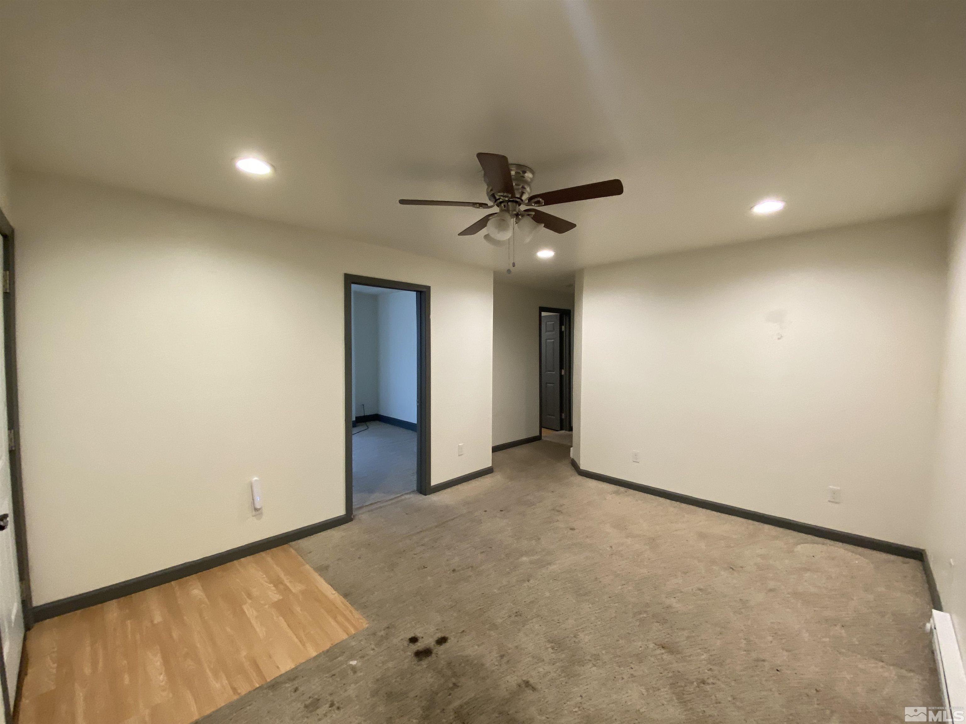 656 Spokane Street Reno, NV 89512 - Photo 17 of 31 an empty room with a ceiling fan and a window