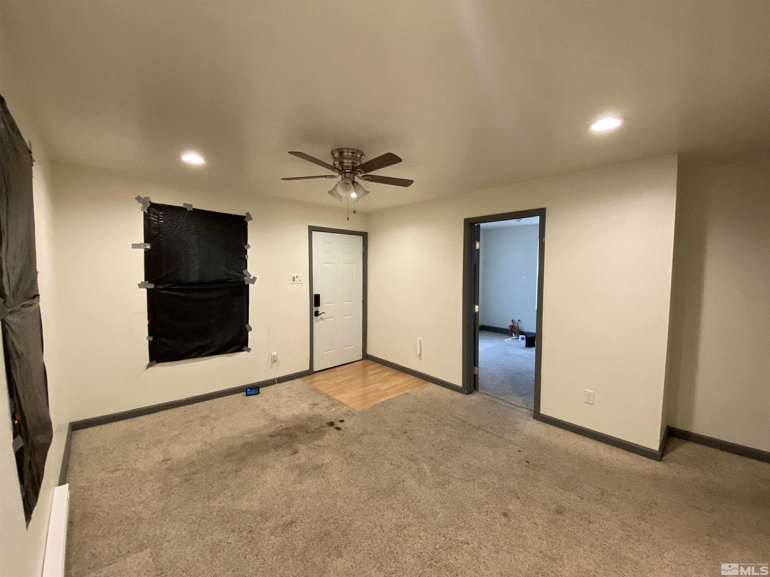 656 Spokane Street Reno, NV 89512 - Photo 19 of 31 an empty room with closet and mirror
