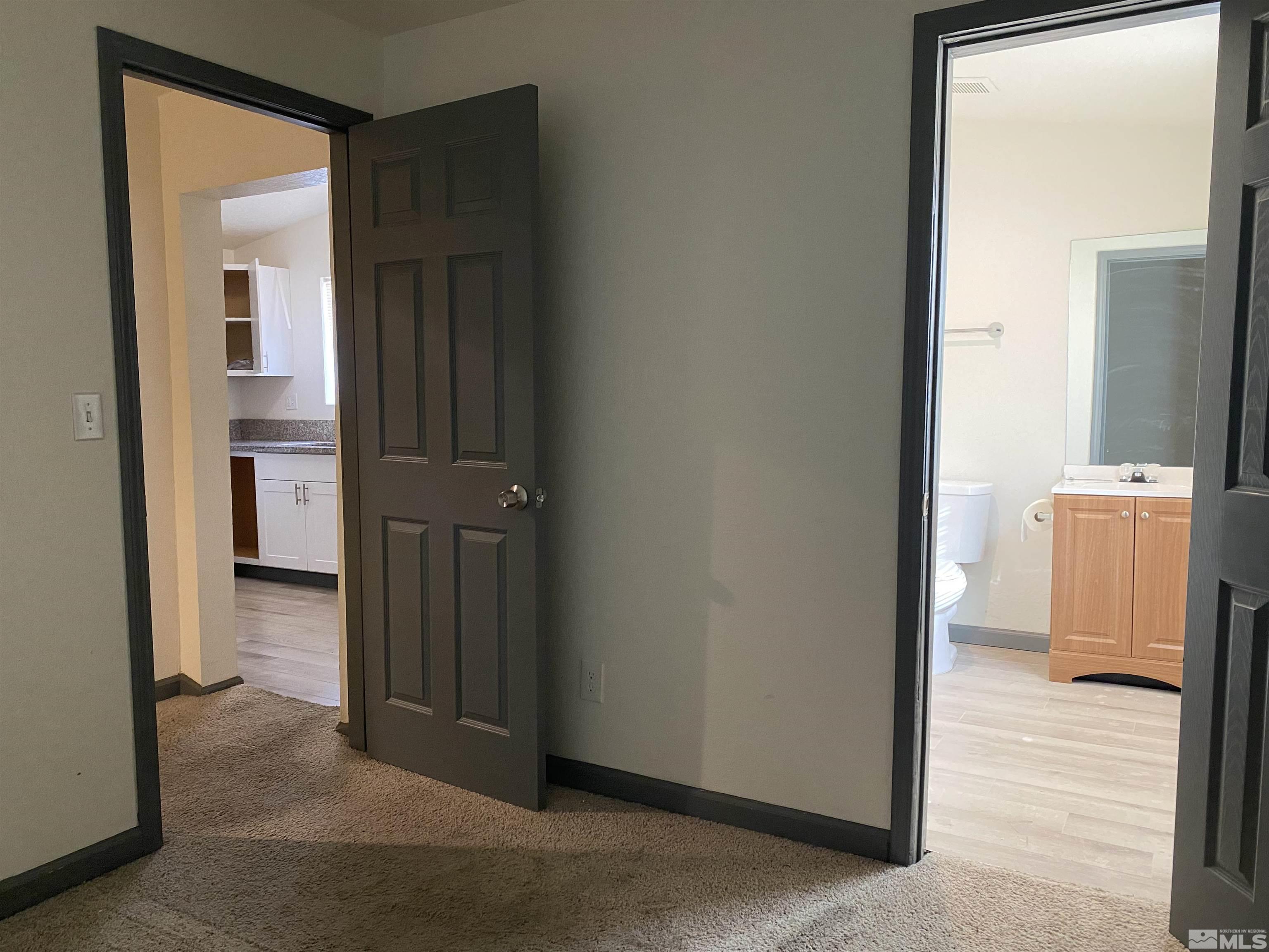 656 Spokane Street Reno, NV 89512 - Photo 21 of 31 a view of a hallway with closet and bathroom