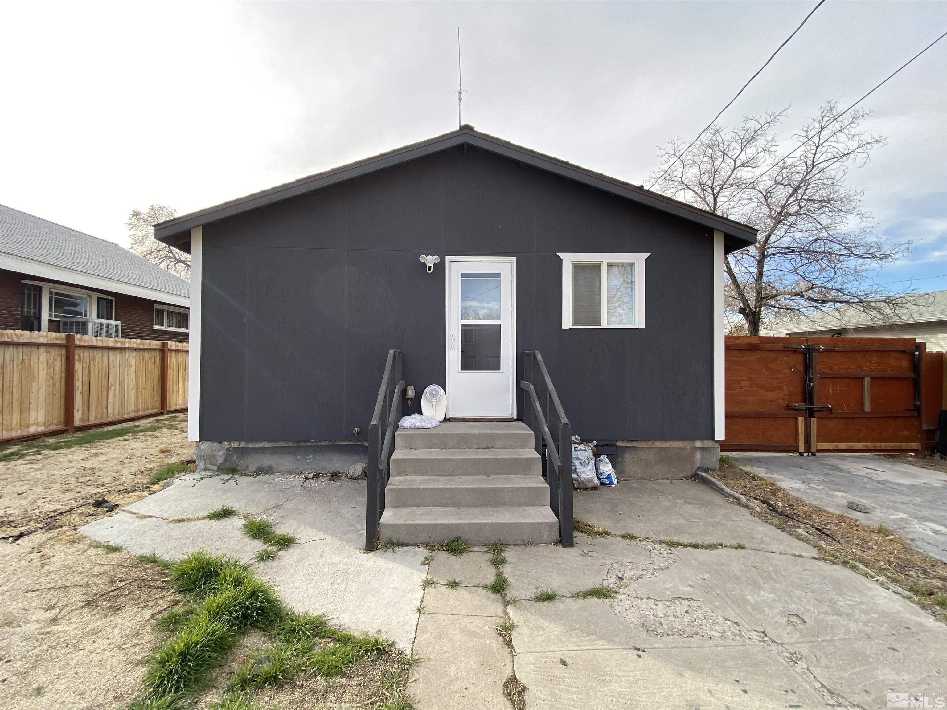 656 Spokane Street Reno, NV 89512 - Photo 25 of 31 a front view of a house with a yard