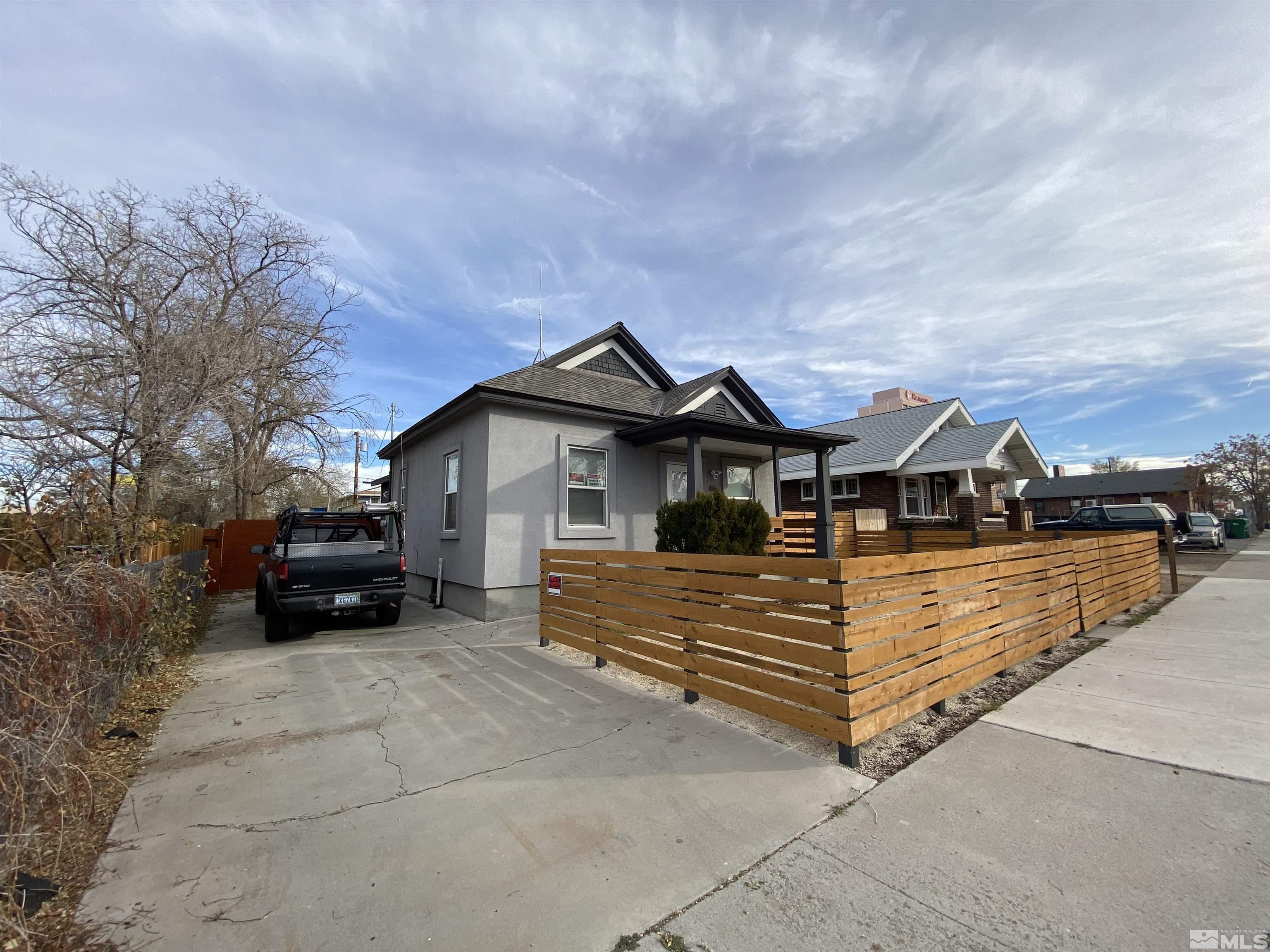 656 Spokane Street Reno, NV 89512 - Photo 31 of 31 a view of a house with a wooden fence