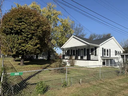 a house with trees in the background