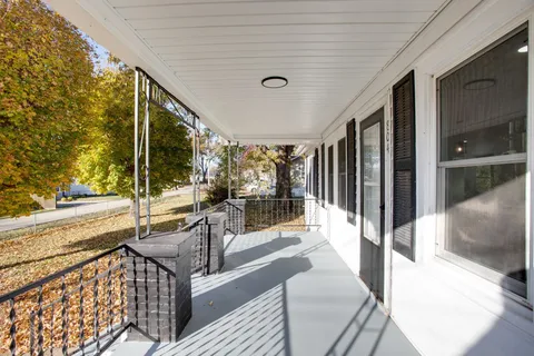 a view of a living room and balcony