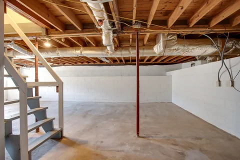 a view of a room with wooden walls