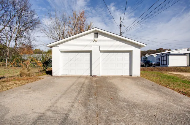 a view of garage and yard